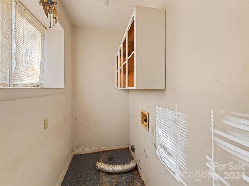 31 Lowe Drive, Waynesville, NC 28786.  MLS# CAR4203338, YatesRealty ID 2296. Laundry- Main Floor
