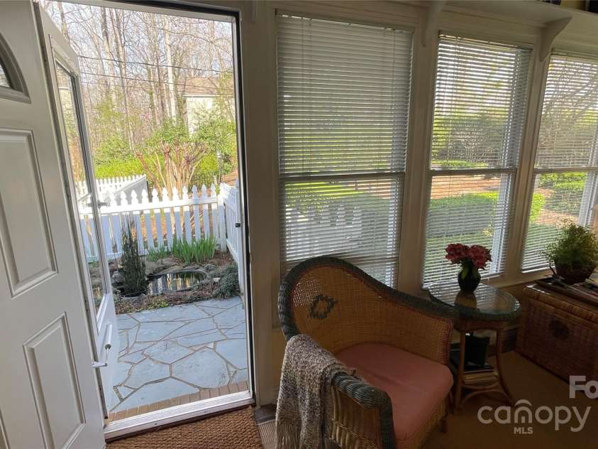 700 Valleyview Drive, Albemarle, NC 28001.  MLS# CAR4258028, YatesRealty ID 22960. View of back yard from sunroom