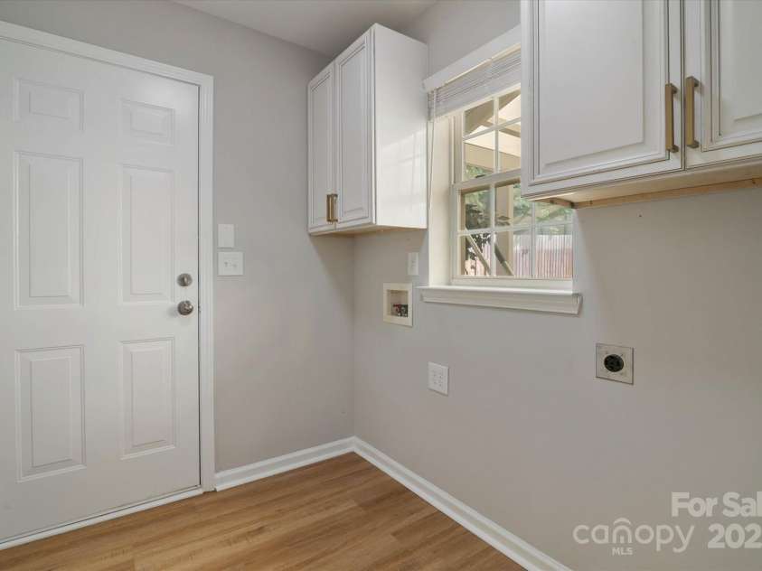 8343 Highlander Court, Charlotte, NC 28269.  MLS# CAR4273780, YatesRealty ID 22964. Dedicated Laundry/Mud Room With Storage Cabinets!