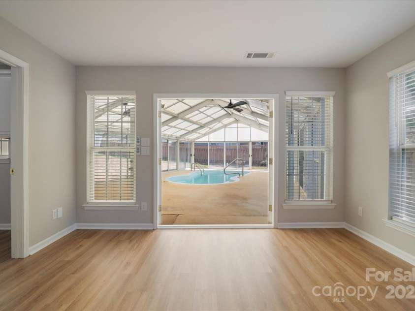 8343 Highlander Court, Charlotte, NC 28269.  MLS# CAR4273780, YatesRealty ID 22964. French Doors Leading To Enclosed Pool!