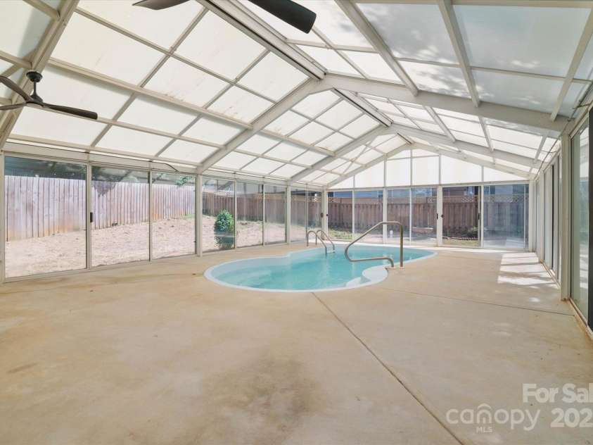 8343 Highlander Court, Charlotte, NC 28269.  MLS# CAR4273780, YatesRealty ID 22964. Unique Enclosed Pool Area With Ceiling Fans!