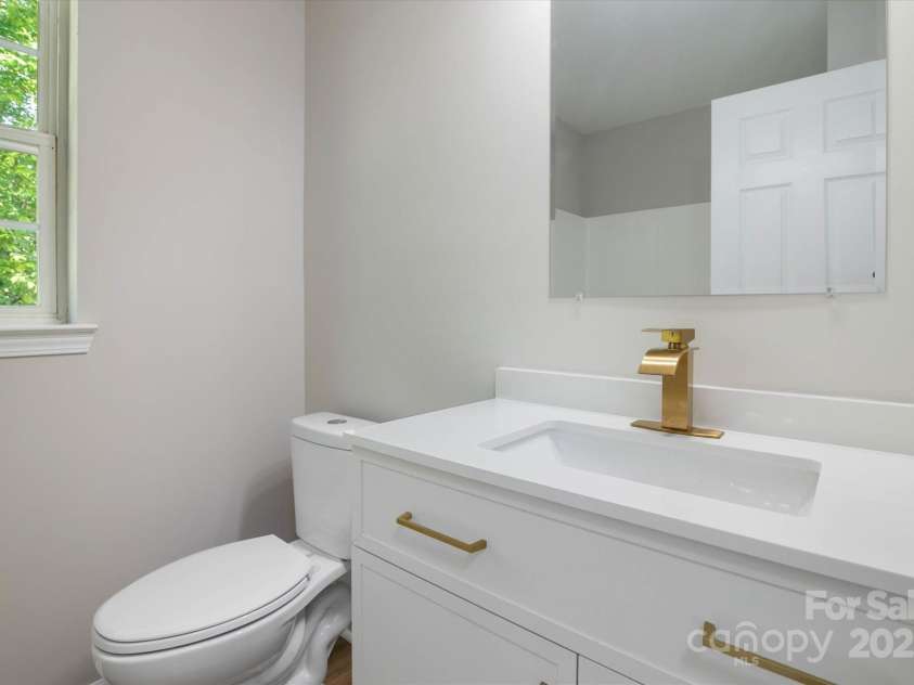 8343 Highlander Court, Charlotte, NC 28269.  MLS# CAR4273780, YatesRealty ID 22964. Upper Hallway Bath With New Vanity And Dual Flush Commode!