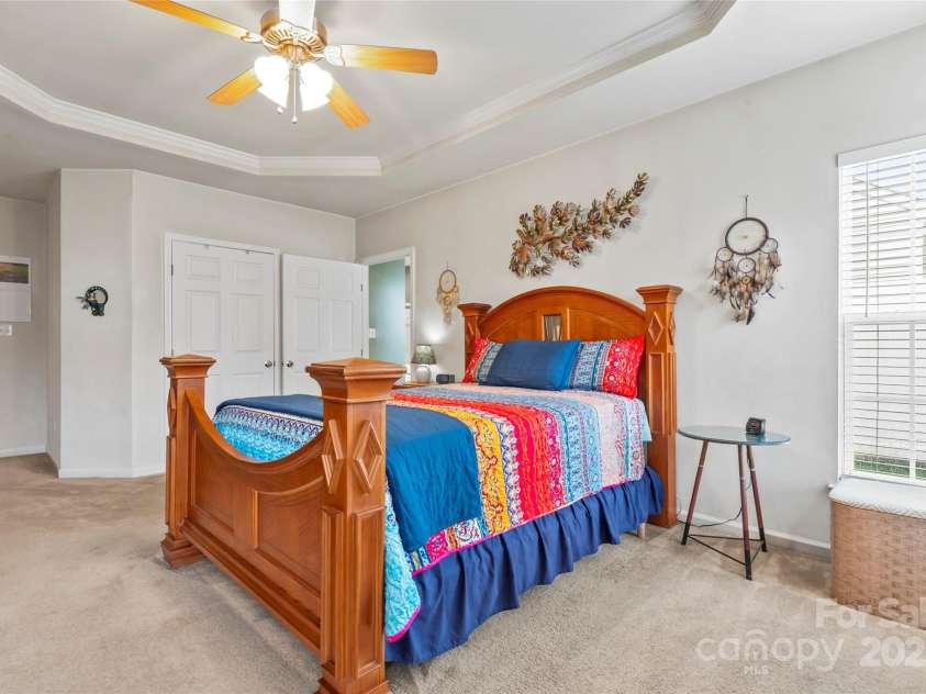 1418 Skidaway Street, Concord, NC 28027.  MLS# CAR4268685, YatesRealty ID 22966. Coffered ceiling and fan in Primary Bedroom