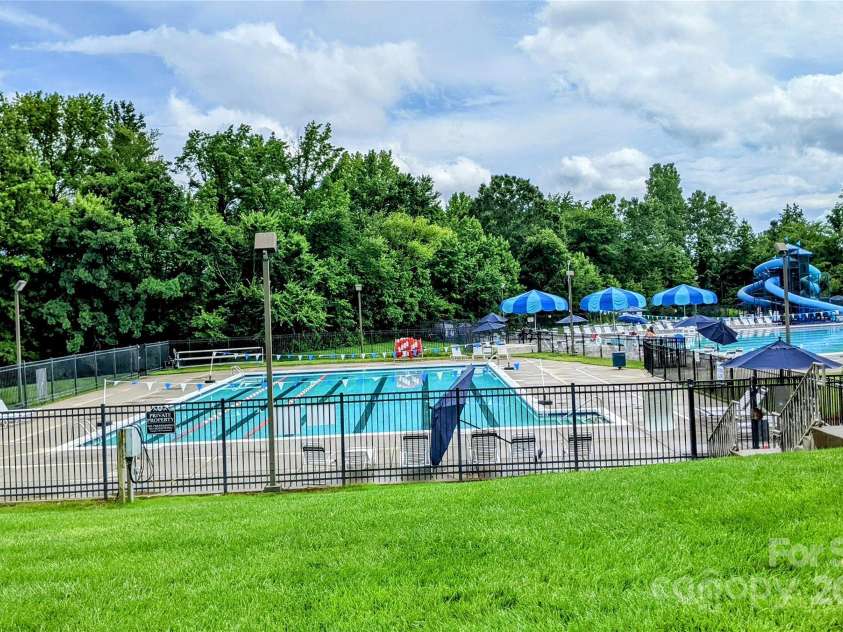 1418 Skidaway Street, Concord, NC 28027.  MLS# CAR4268685, YatesRealty ID 22966. Olympic size pool, kids pool, adult pool