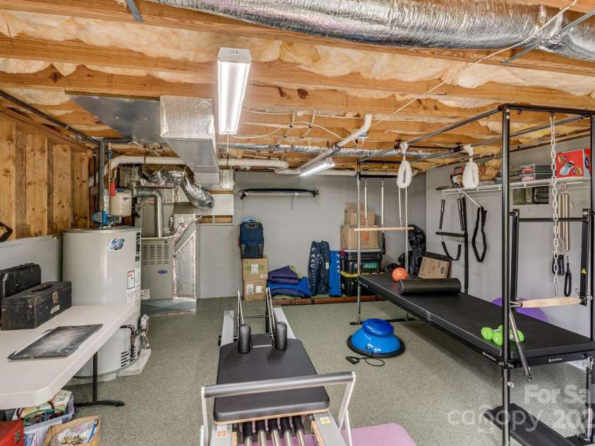 118 Broadmoor Drive, Flat Rock, NC 28731.  MLS# CAR4275218, YatesRealty ID 22968. A perfect area for a workshop, gym or golf car strorage.
