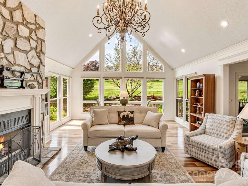 118 Broadmoor Drive, Flat Rock, NC 28731.  MLS# CAR4275218, YatesRealty ID 22968. Cozy up to the fireplace in the cooler months. There are lovely built-in shevling and cabinets for your libray of books or artwork.