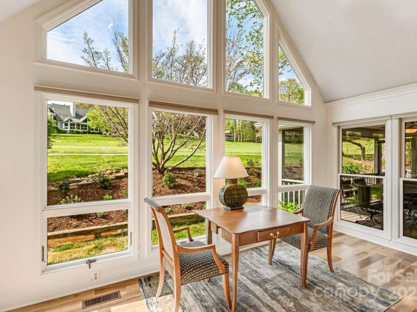 118 Broadmoor Drive, Flat Rock, NC 28731.  MLS# CAR4275218, YatesRealty ID 22968. Enjoy the sunshine! Custom window treatments easily pull down for privacy.