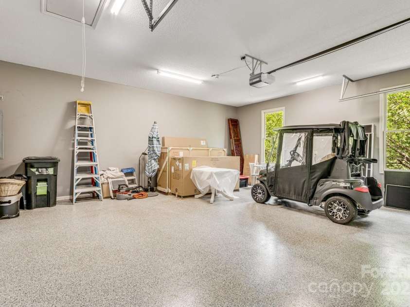 118 Broadmoor Drive, Flat Rock, NC 28731.  MLS# CAR4275218, YatesRealty ID 22968. The two-car garage has an epoxy floor.
