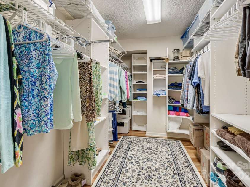 118 Broadmoor Drive, Flat Rock, NC 28731.  MLS# CAR4275218, YatesRealty ID 22968. This large closet has tons of storage in the built-in cabinets and cubbies.
