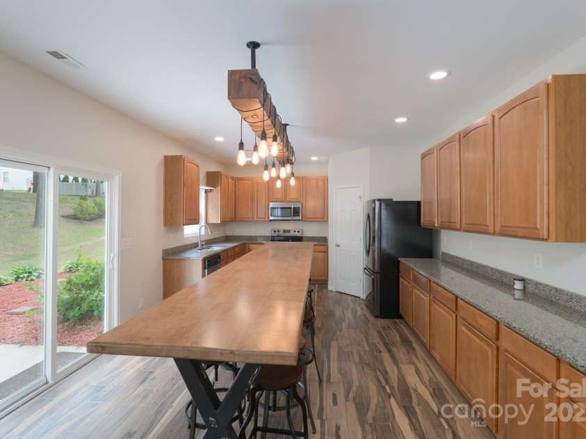 1144 Spicewood Pines Road, Fort Mill, SC 29708.  MLS# CAR4246167, YatesRealty ID 22970. Kitchen (large moveable island shown)