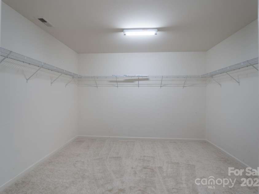 1144 Spicewood Pines Road, Fort Mill, SC 29708.  MLS# CAR4246167, YatesRealty ID 22970. Primary bedroom large walk-in closet