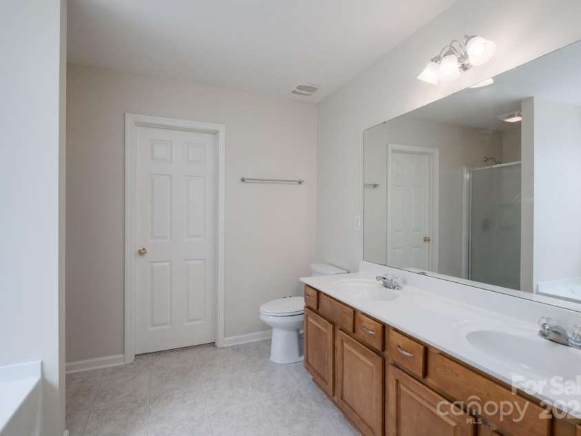 1144 Spicewood Pines Road, Fort Mill, SC 29708.  MLS# CAR4246167, YatesRealty ID 22970. Primary ensuite with door to large walk-in closet