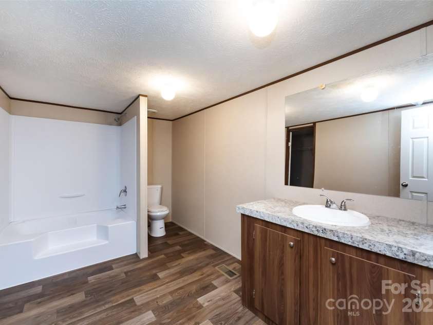 716 Sharon Lane, Iron Station, NC 28080.  MLS# CAR4273839, YatesRealty ID 22974. 