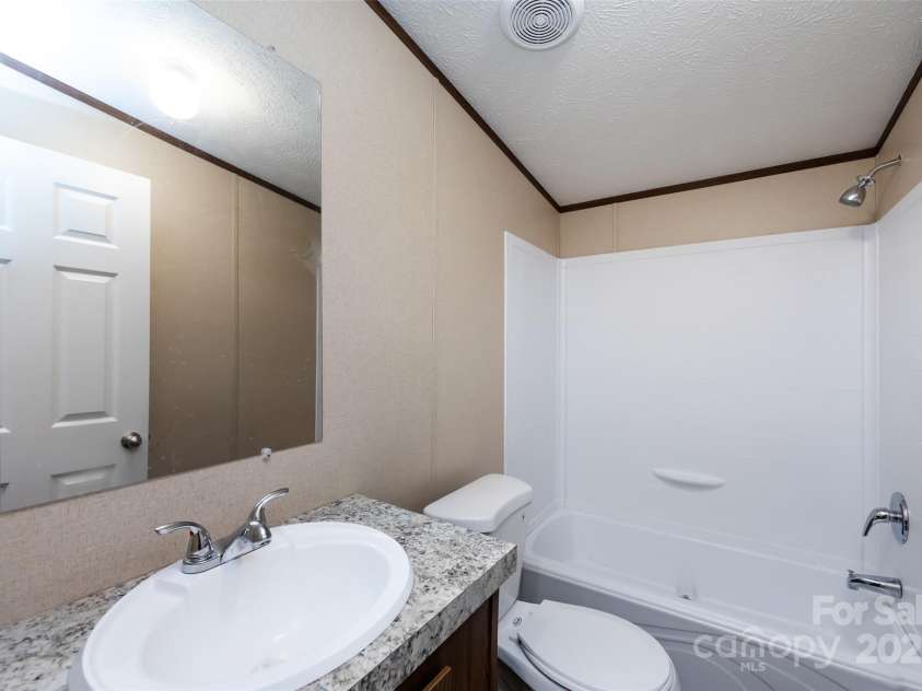 716 Sharon Lane, Iron Station, NC 28080.  MLS# CAR4273839, YatesRealty ID 22974. 