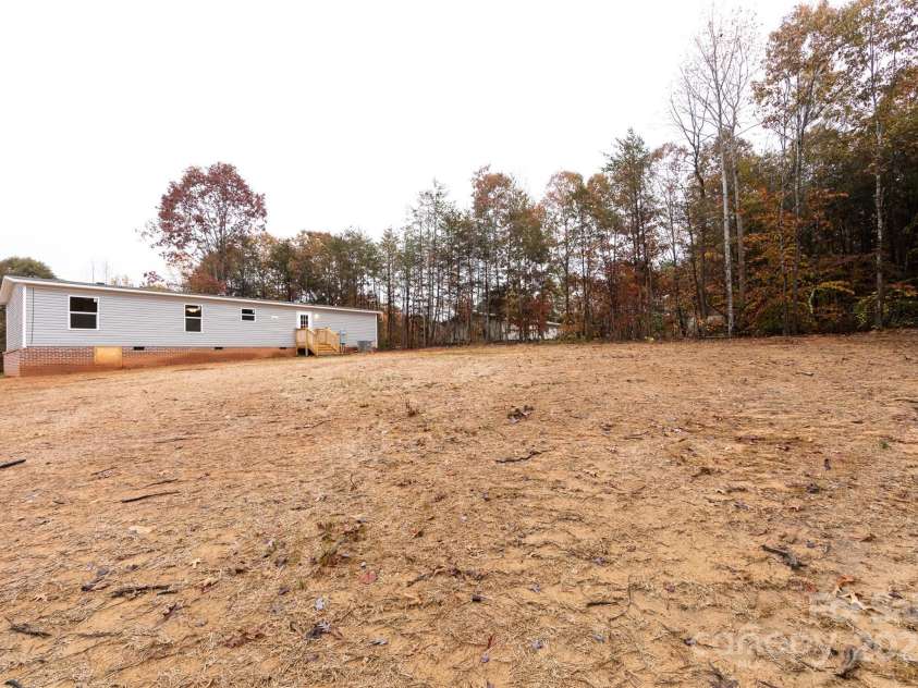 716 Sharon Lane, Iron Station, NC 28080.  MLS# CAR4273839, YatesRealty ID 22974. 