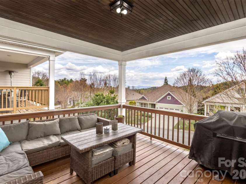 84 Rose Creek Road, Leicester, NC 28748.  MLS# CAR4377582, YatesRealty ID 22978. Covered Back Porch