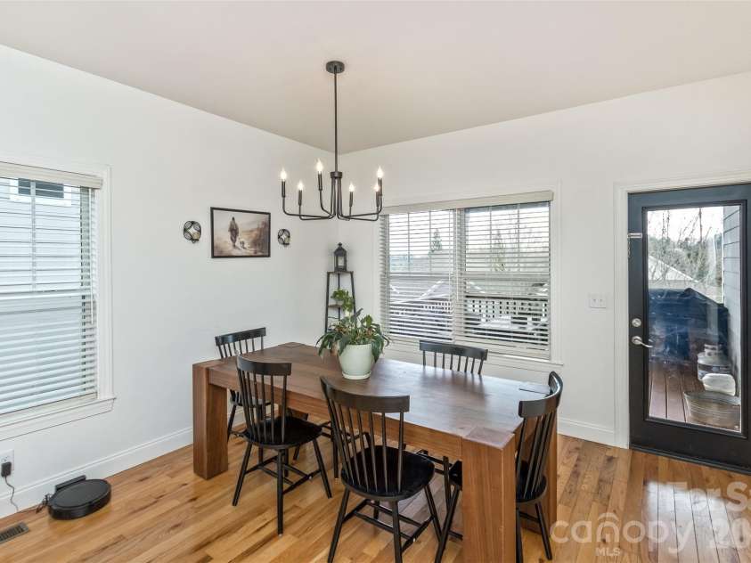 84 Rose Creek Road, Leicester, NC 28748.  MLS# CAR4377582, YatesRealty ID 22978. Dining Area to covered back deck