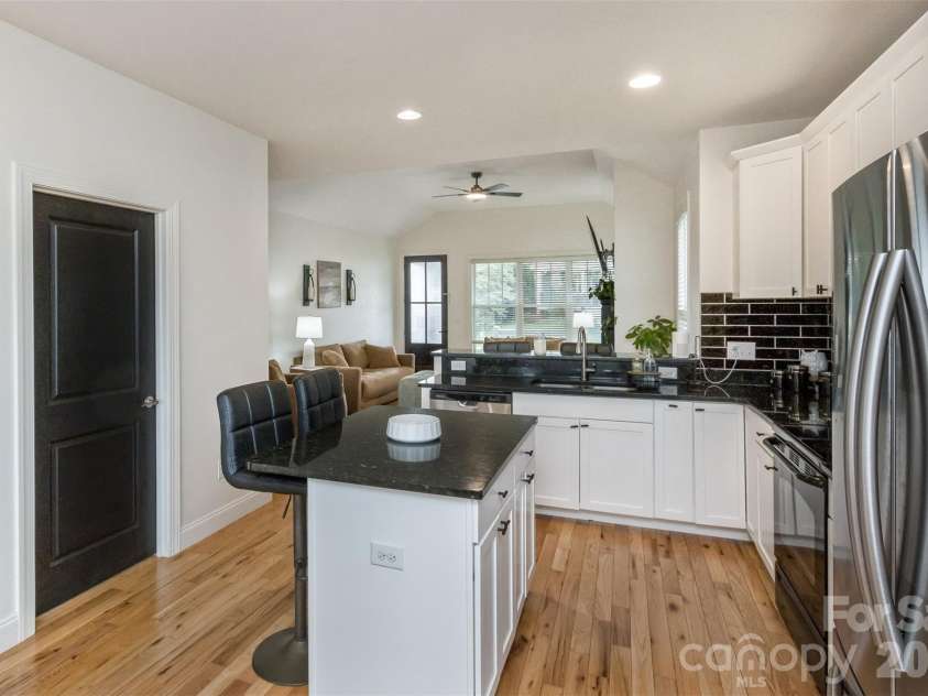 84 Rose Creek Road, Leicester, NC 28748.  MLS# CAR4377582, YatesRealty ID 22978. Kitchen looking into Living Space