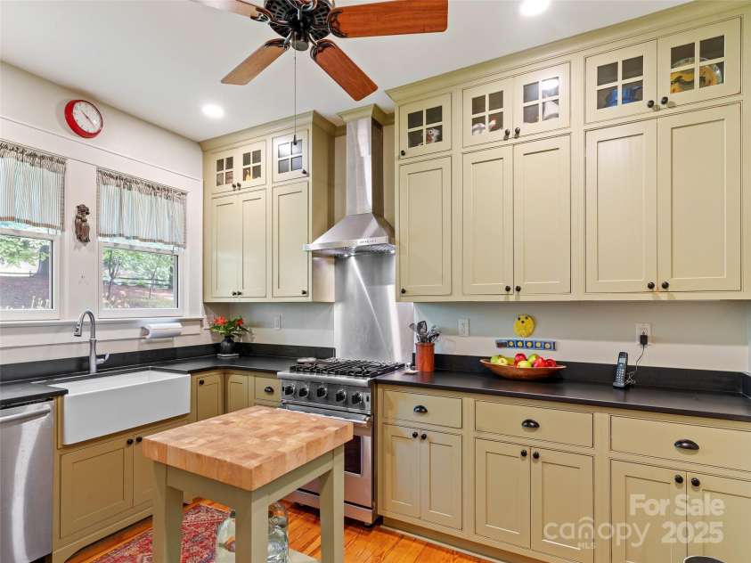 18 Hill Street, Saluda, NC 28773.  MLS# CAR4271722, YatesRealty ID 22979. The kitchen has been completely renovated with new cabinetry, granite countertops and appliances including a Viking range and Bosch dishwasher.
