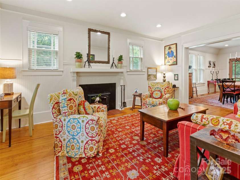 18 Hill Street, Saluda, NC 28773.  MLS# CAR4271722, YatesRealty ID 22979. The living room left of the foyer extends toward the dining room.