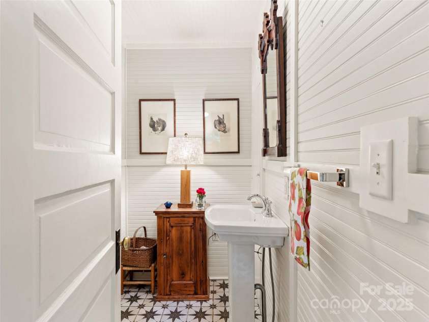 18 Hill Street, Saluda, NC 28773.  MLS# CAR4271722, YatesRealty ID 22979. Timeless character in the renovated powder room by the kitchen and breakfast room.