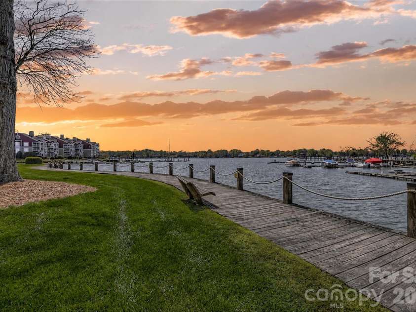 702 Southwest Drive, Davidson, NC 28036.  MLS# CAR4378717, YatesRealty ID 22982. Community lakefront boardwalk