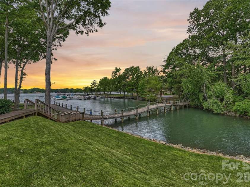 702 Southwest Drive, Davidson, NC 28036.  MLS# CAR4378717, YatesRealty ID 22982. Community lakefront boardwalk