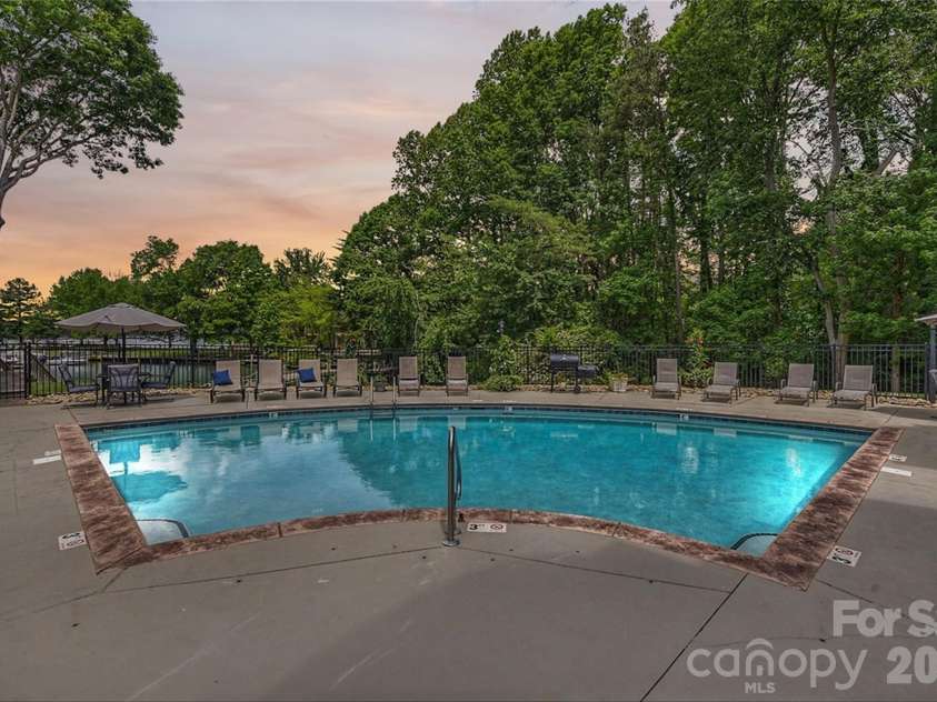 702 Southwest Drive, Davidson, NC 28036.  MLS# CAR4378717, YatesRealty ID 22982. Community pool with lake views