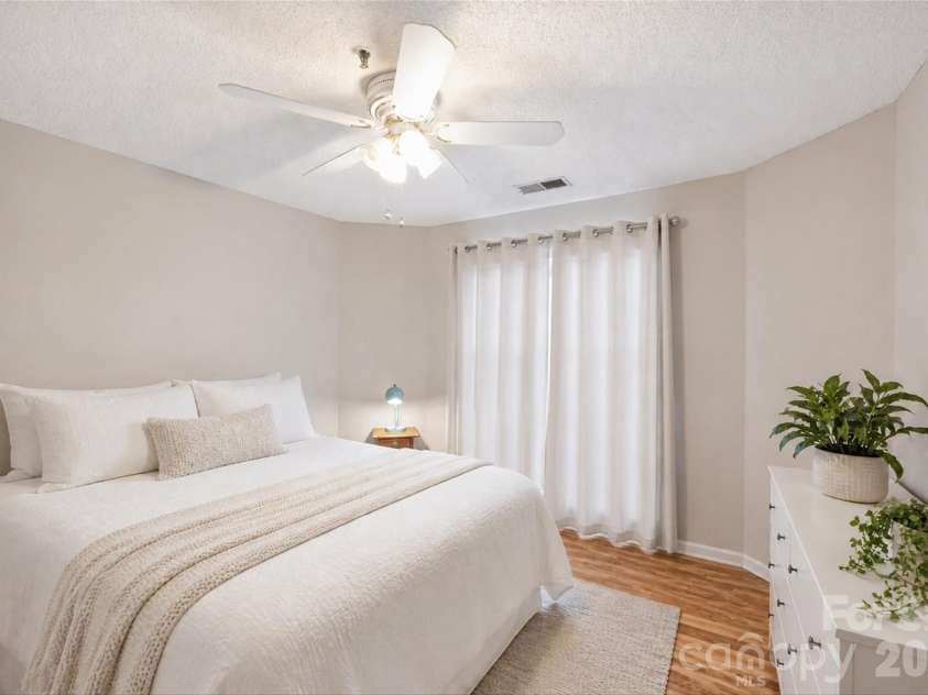702 Southwest Drive, Davidson, NC 28036.  MLS# CAR4378717, YatesRealty ID 22982. Virtually staged to show alternate bedroom furniture