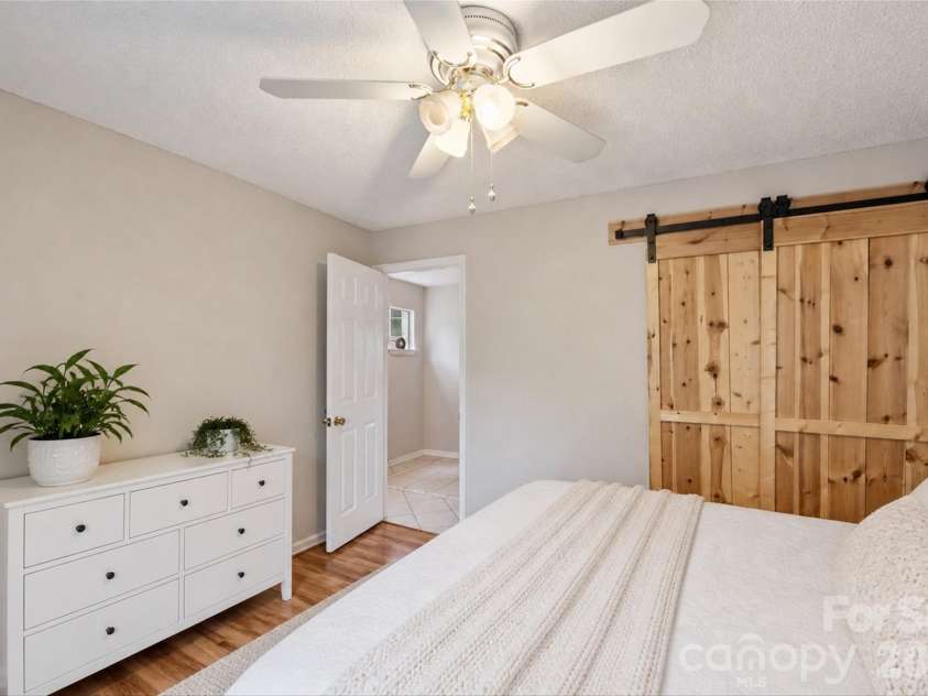 702 Southwest Drive, Davidson, NC 28036.  MLS# CAR4378717, YatesRealty ID 22982. Virtually staged to show alternate bedroom furniture