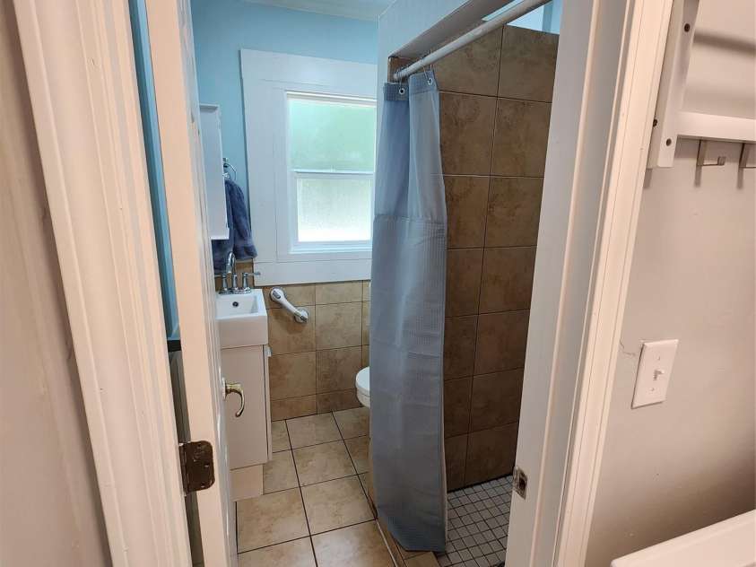 703/705 Smith Street, Kannapolis, NC 28083.  MLS# CAR4275773, YatesRealty ID 22983. Bathroom has tiled stand-up shower stall