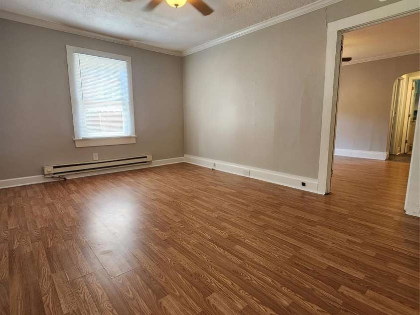 703/705 Smith Street, Kannapolis, NC 28083.  MLS# CAR4275773, YatesRealty ID 22983. Living Rm into bedroom