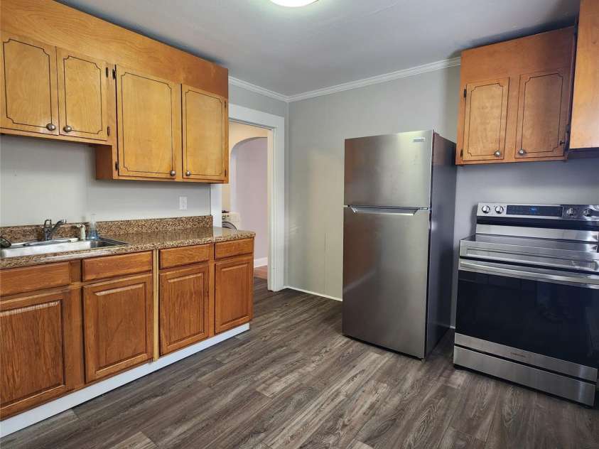 703/705 Smith Street, Kannapolis, NC 28083.  MLS# CAR4275773, YatesRealty ID 22983. New fridge, stove and waterproof Shaw flooring.