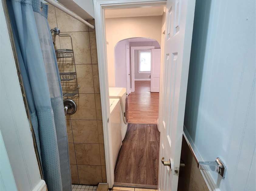 703/705 Smith Street, Kannapolis, NC 28083.  MLS# CAR4275773, YatesRealty ID 22983. View from bathroom to bedroom, left side of duplex