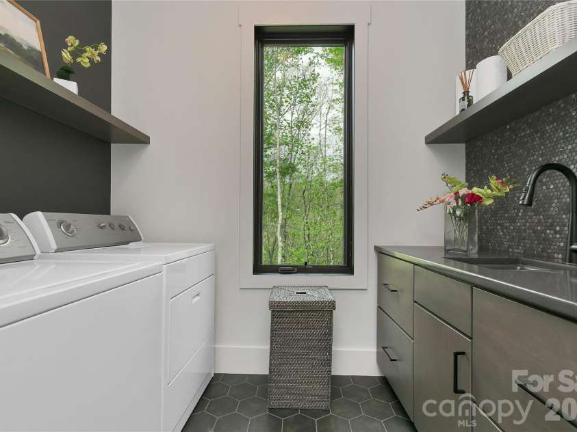 726 Ugugu Drive, Brevard, NC 28712.  MLS# CAR4374214, YatesRealty ID 22985. Main level Laundry room