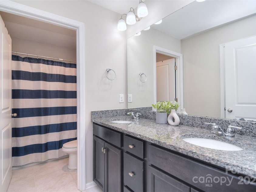 2014 Burton Point Court, Waxhaw, NC 28173.  MLS# CAR4248200, YatesRealty ID 22990. 2nd Floor Bathroom