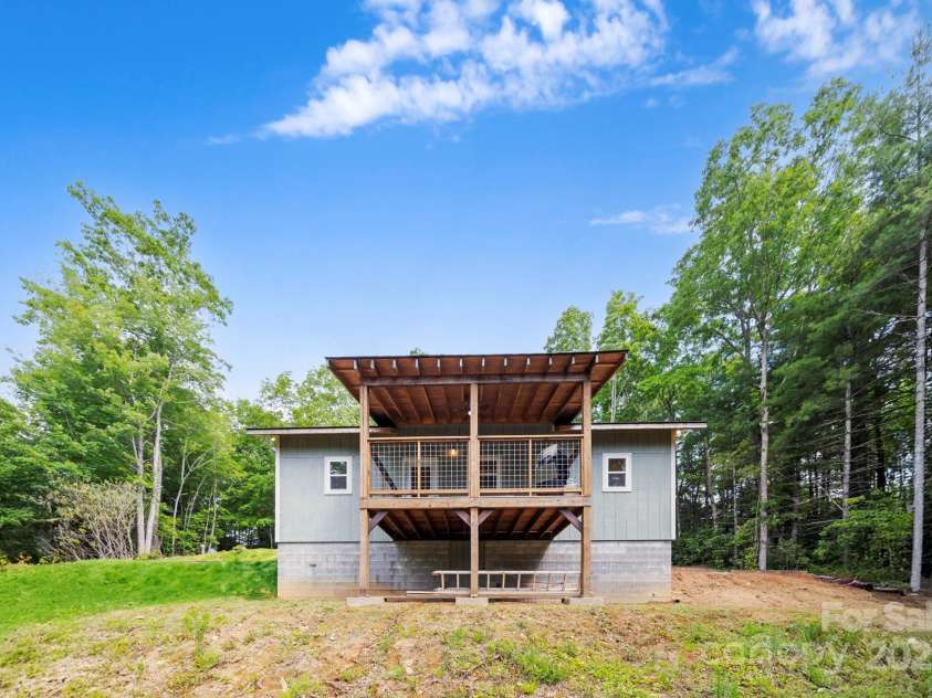 185 Little Elbow Mountain Road, Lake Toxaway, NC 28747.  MLS# CAR4265070, YatesRealty ID 22994. Back view of house