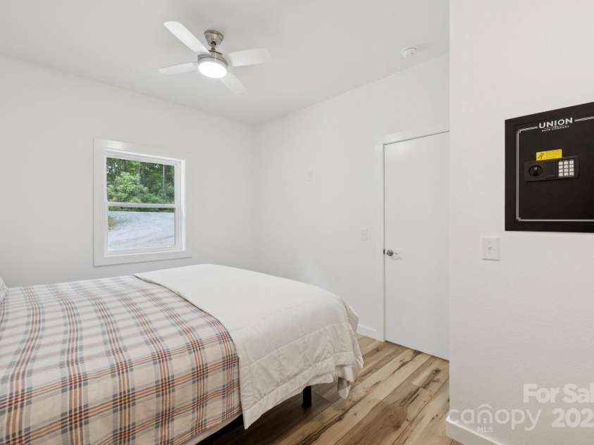 185 Little Elbow Mountain Road, Lake Toxaway, NC 28747.  MLS# CAR4265070, YatesRealty ID 22994. Bedroom 2 with wall safe