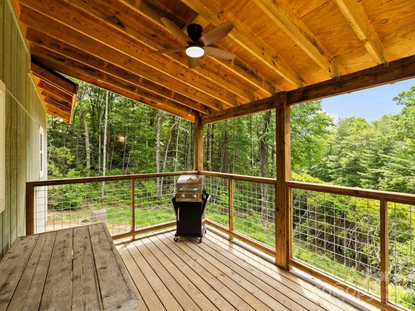 185 Little Elbow Mountain Road, Lake Toxaway, NC 28747.  MLS# CAR4265070, YatesRealty ID 22994. Covered back porch