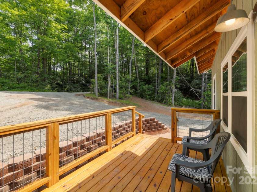 185 Little Elbow Mountain Road, Lake Toxaway, NC 28747.  MLS# CAR4265070, YatesRealty ID 22994. Front porch - just waiting for the rocking chairs