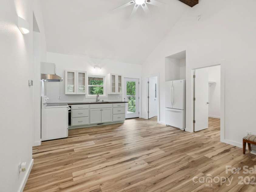 185 Little Elbow Mountain Road, Lake Toxaway, NC 28747.  MLS# CAR4265070, YatesRealty ID 22994. Kitchen and great room