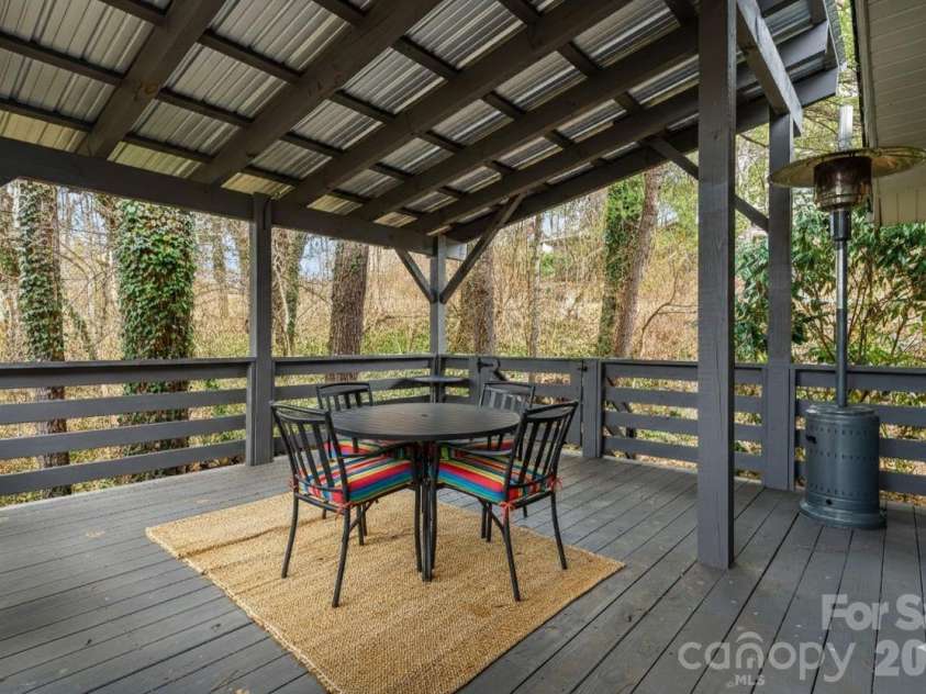 61 White Dogwood Lane, Lake Junaluska, NC 28745.  MLS# CAR4344094, YatesRealty ID 22998. Virtually staged deck off kitchen/dining area