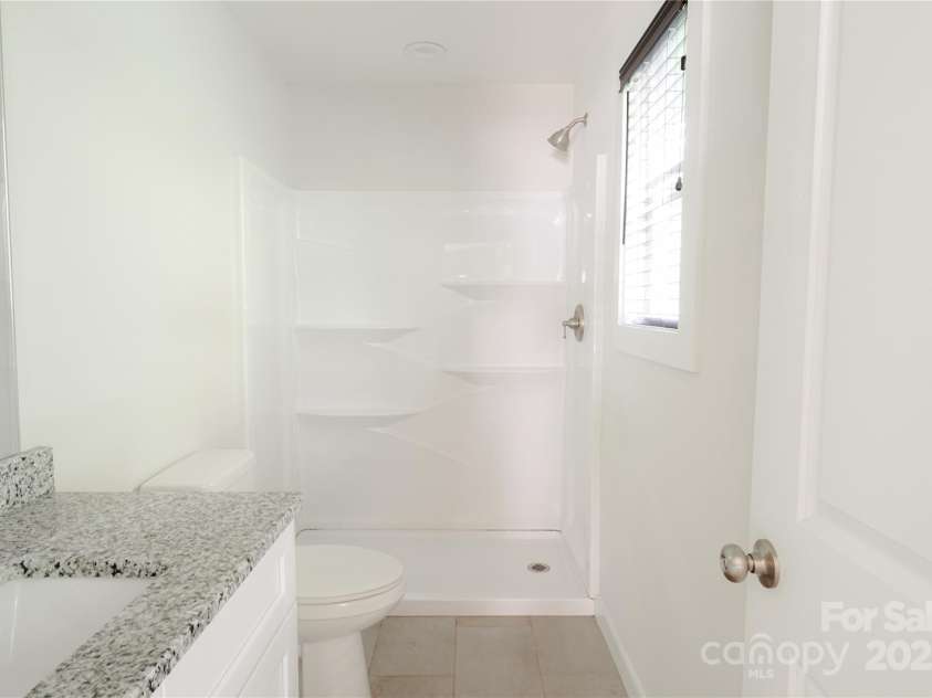 2908 Burgess Drive, Charlotte, NC 28208.  MLS# CAR4257726, YatesRealty ID 22999. Master Bath