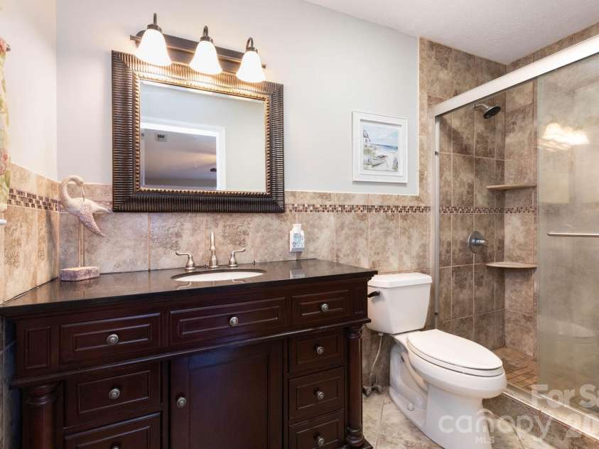 143 Devonwood Drive, Marion, NC 28752.  MLS# CAR4358498, YatesRealty ID 23001. Main Level: Primary Full Bath