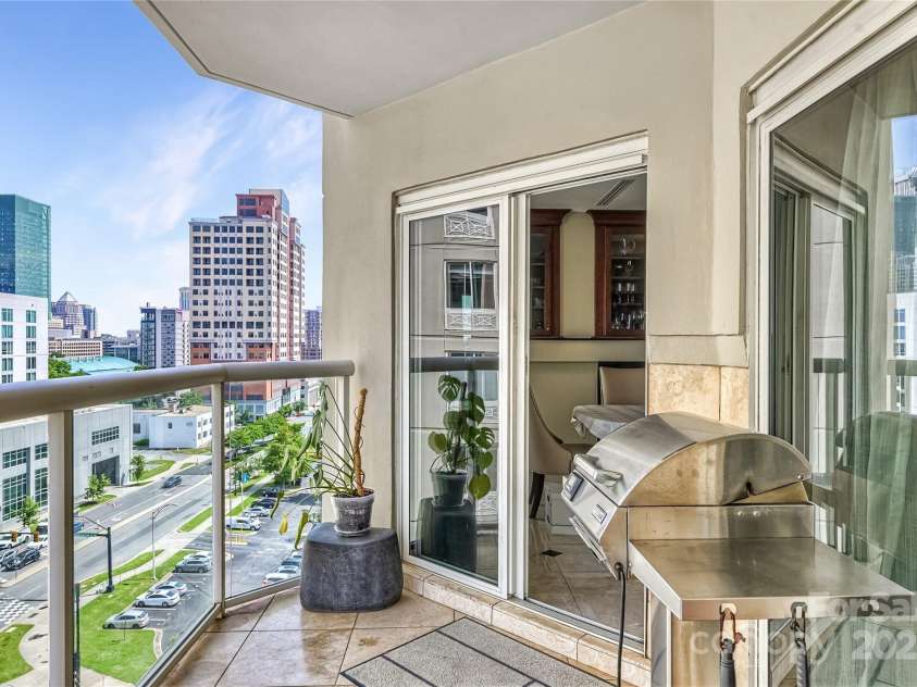 520 Martin Luther King Jr Boulevard, Charlotte, NC 28202.  MLS# CAR4260279, YatesRealty ID 23004. Terrace 2 accessible from living room, primary bedroom  bedroom AND 2nd bedroom