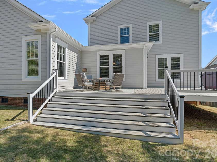 5595 Morris Hunt Drive, Fort Mill, SC 29708.  MLS# CAR4359670, YatesRealty ID 23004. Large patio and seating area