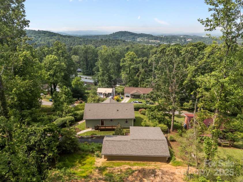 17 Laurel Road, Arden, NC 28704.  MLS# CAR4265020, YatesRealty ID 23009. Aerial view from the back looking south