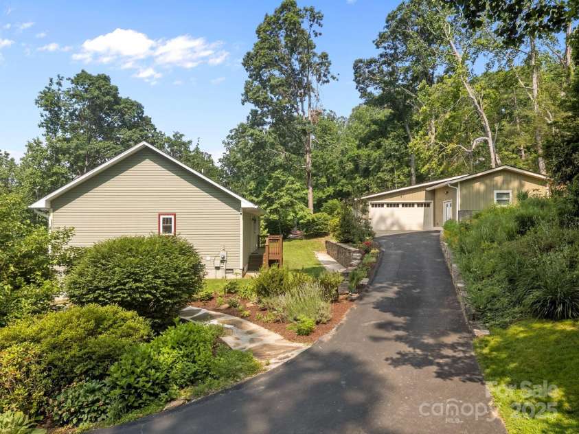 17 Laurel Road, Arden, NC 28704.  MLS# CAR4265020, YatesRealty ID 23009. Beautifully landscaped gardens and detached garage/workshop space