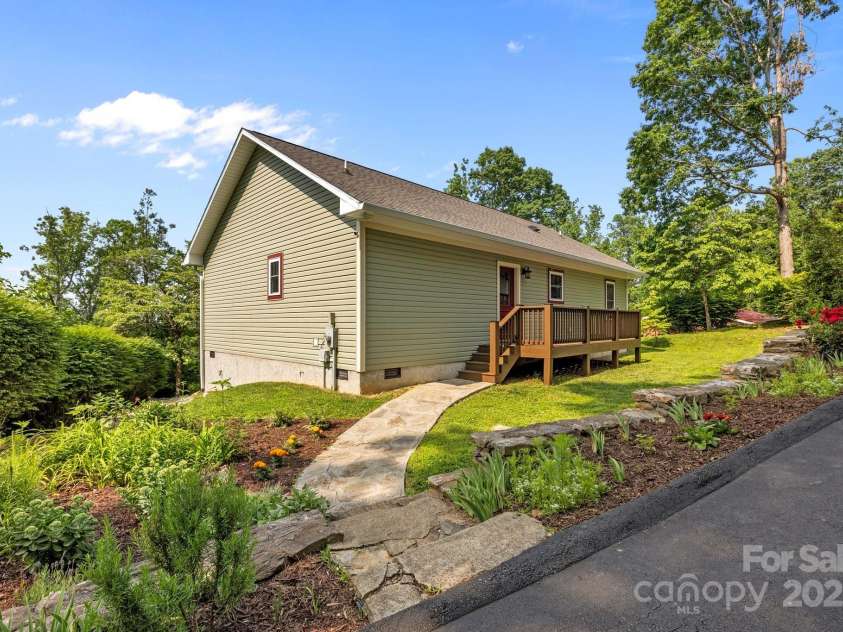 17 Laurel Road, Arden, NC 28704.  MLS# CAR4265020, YatesRealty ID 23009. Garden beds complete with herbs, butterfly bushes and ornamentals