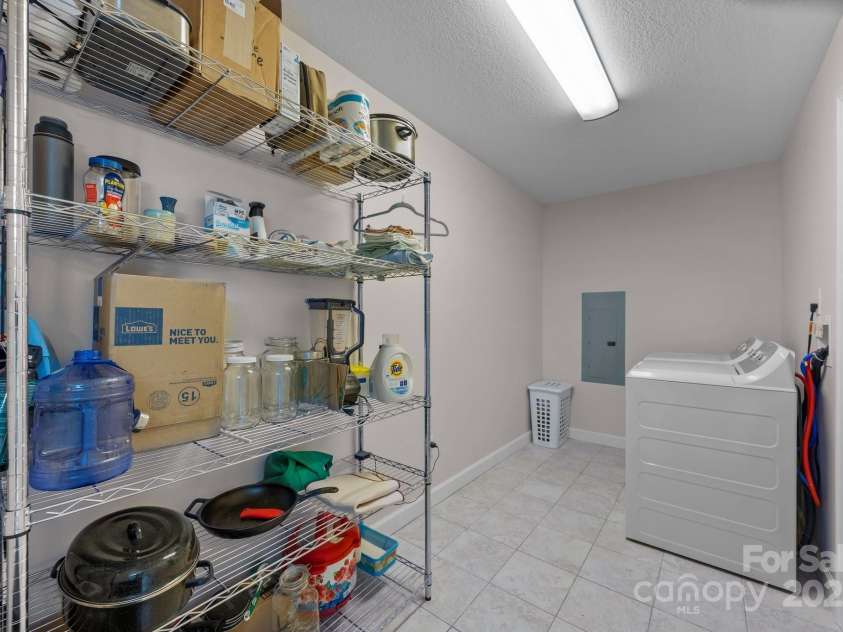 17 Laurel Road, Arden, NC 28704.  MLS# CAR4265020, YatesRealty ID 23009. Pantry and laundry room